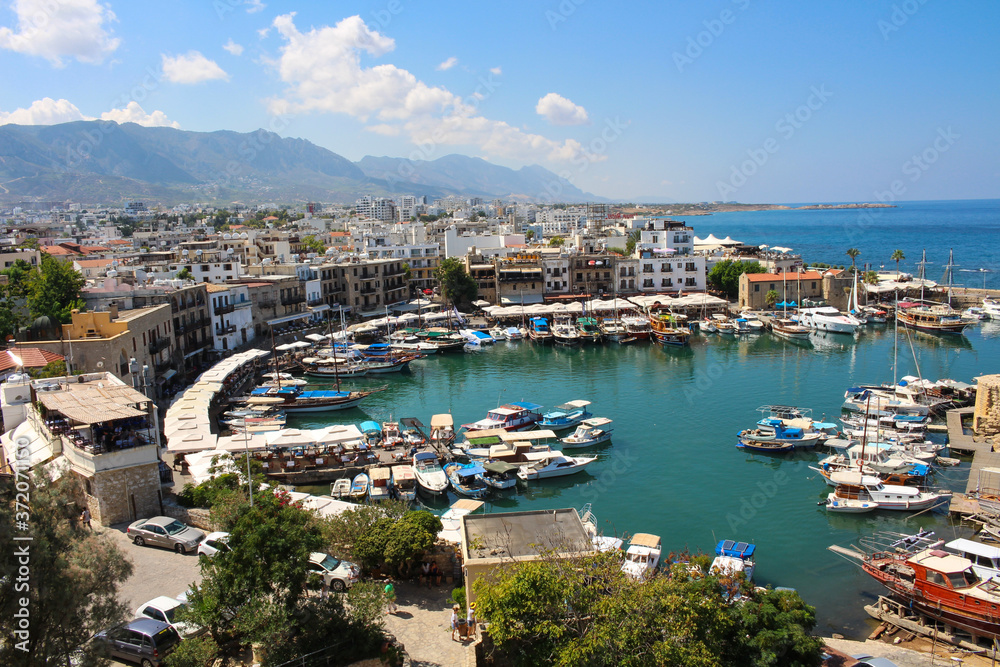 View from the fortress of Kyrenia Harbor, Kyrenia houses and mountains.