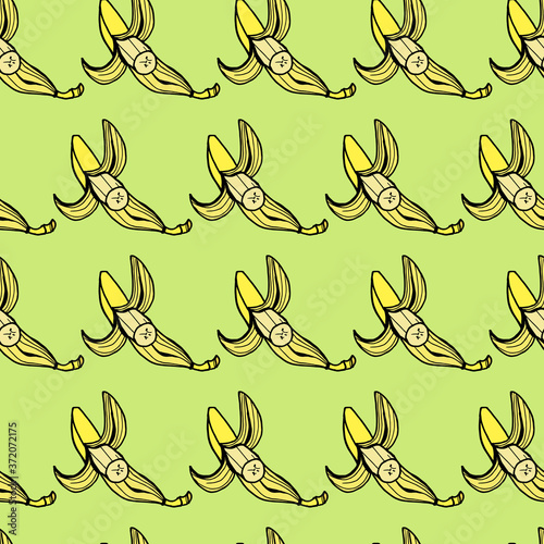 seamless pattern yellow bananas with a black outline on a light green background