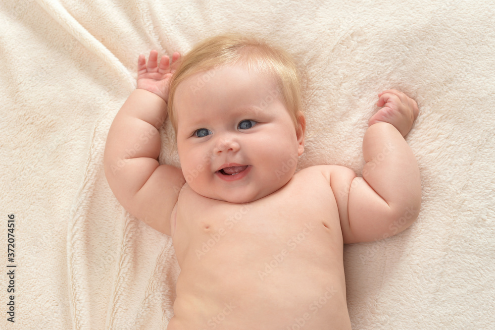 Cute little baby girl on bed lying Cute little baby girl on bed lying