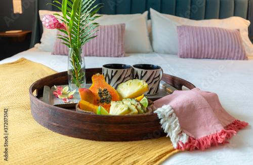 Fototapeta Naklejka Na Ścianę i Meble -  Tropical fruit tray on bed