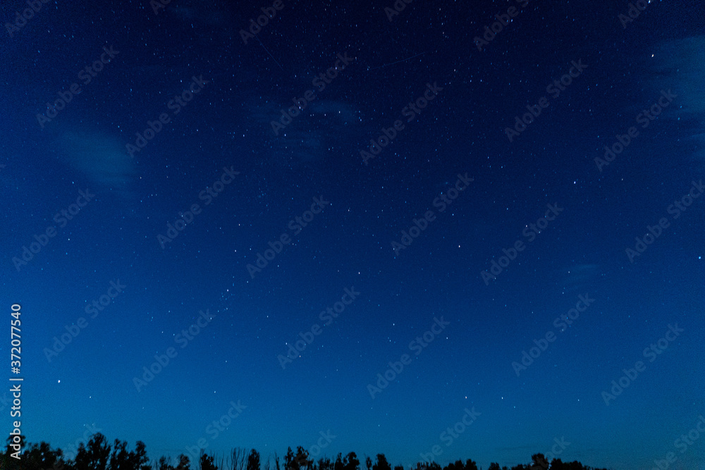 Fototapeta premium Cloudly night sky near the river