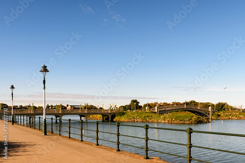 Depopulated promenade along the river.