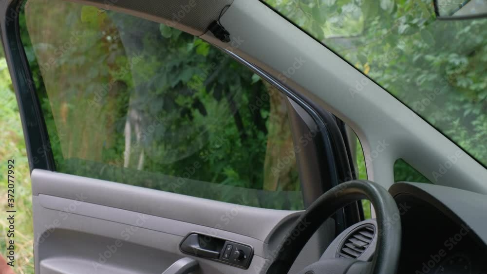 Medical protective mask to protect against viruses inside the car. Pandemic, quarantine. Health care concept. Lifestyle. Medical protective mask to protect against viruses inside the car. Pandemic, quarantine. Health care concept. Lifestyle.