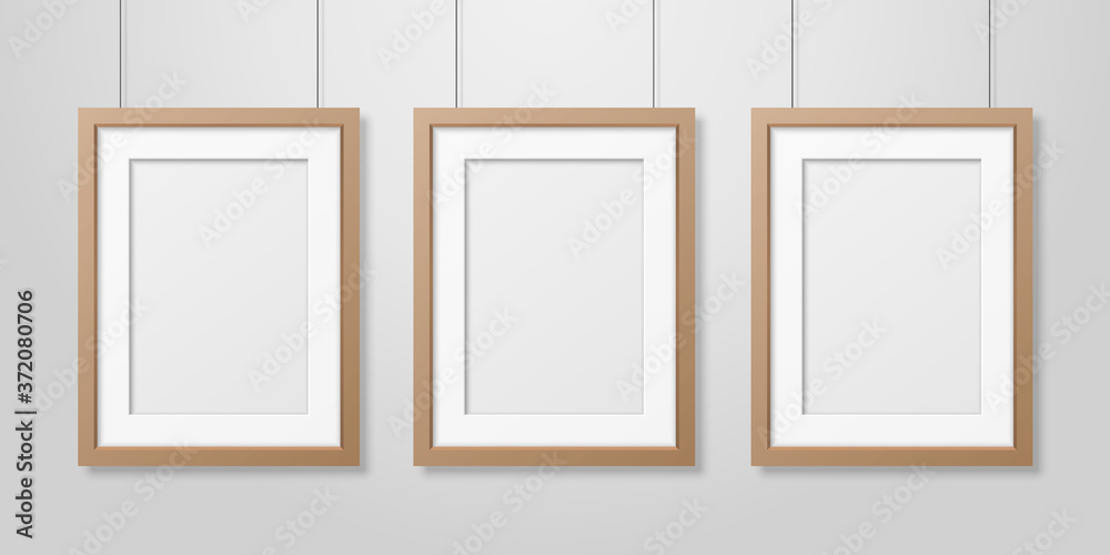 Vector 3d Realistic Three A4 Brown Wooden Simple Modern Frame on a White Wall Background. It can be used for presentations. Design Template for Mockup, Front View Vector 3d Realistic Three A4 Brown Wooden Simple Modern Frame on a White Wall Background. It can be used for presentations. Design Template for Mockup, Front View