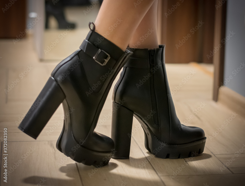 Woman's leg in high heels shoes with platform. Woman's leg in high heels shoes with platform.