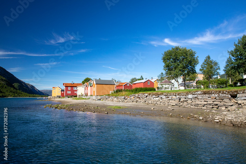 Old wooden houses by the river Vefsna in Nordland county