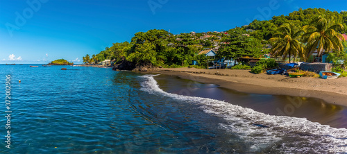 A view of surf breaking on the shoreline at Barrouallie, Saint Vincent