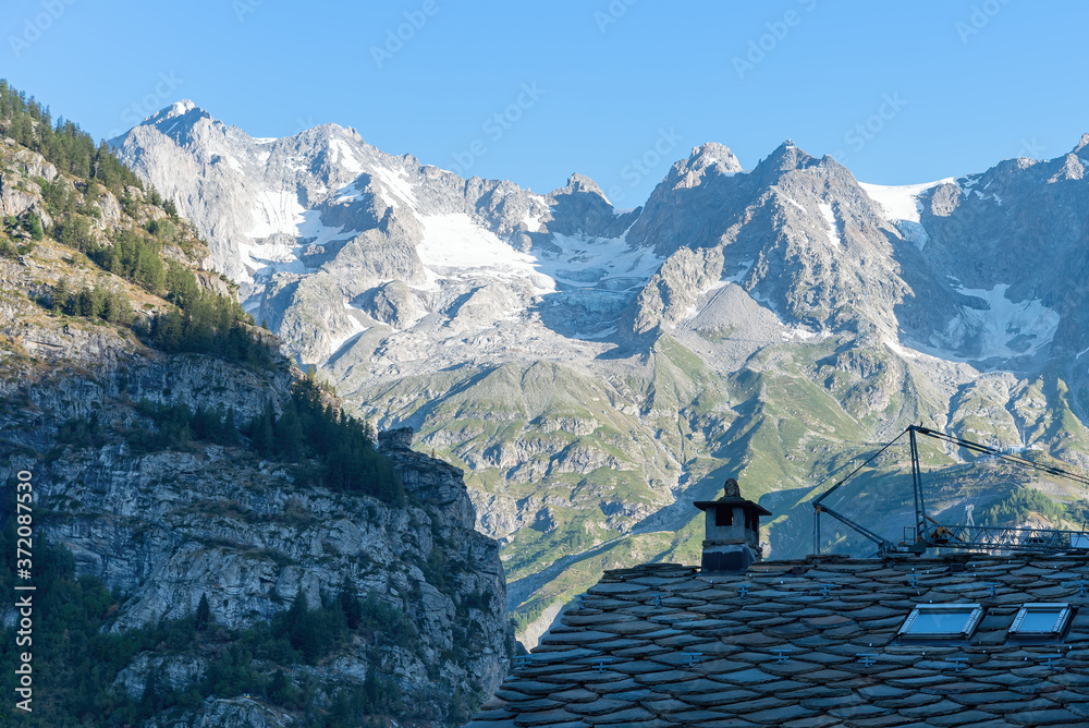 Roof of Courmayeur houses with a view of Mont Blanc - Valle d'Aosta - Italy