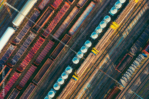 Drone view on rail cargo transportation. Freight wagons from above.
