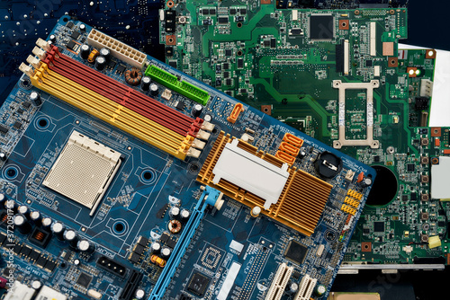 Fotografie Close up of colored heap of electronic, plastic and metal parts from old discarded or obsolete PC components