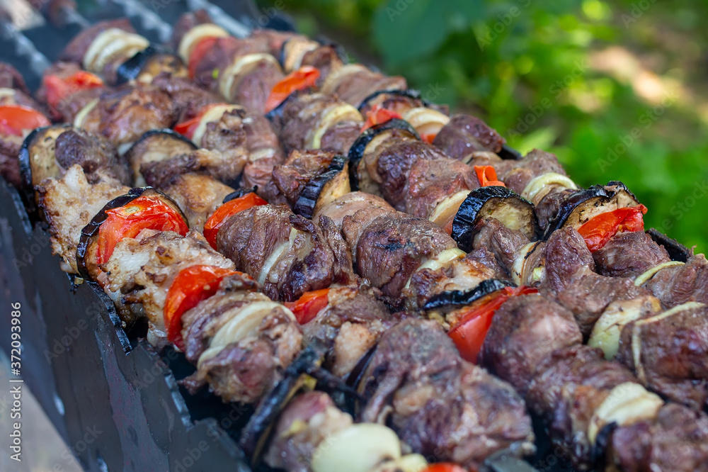 Skewers uncooked in nature on skewers in the open air. shashlyk Skewers uncooked in nature on skewers in the open air. shashlyk