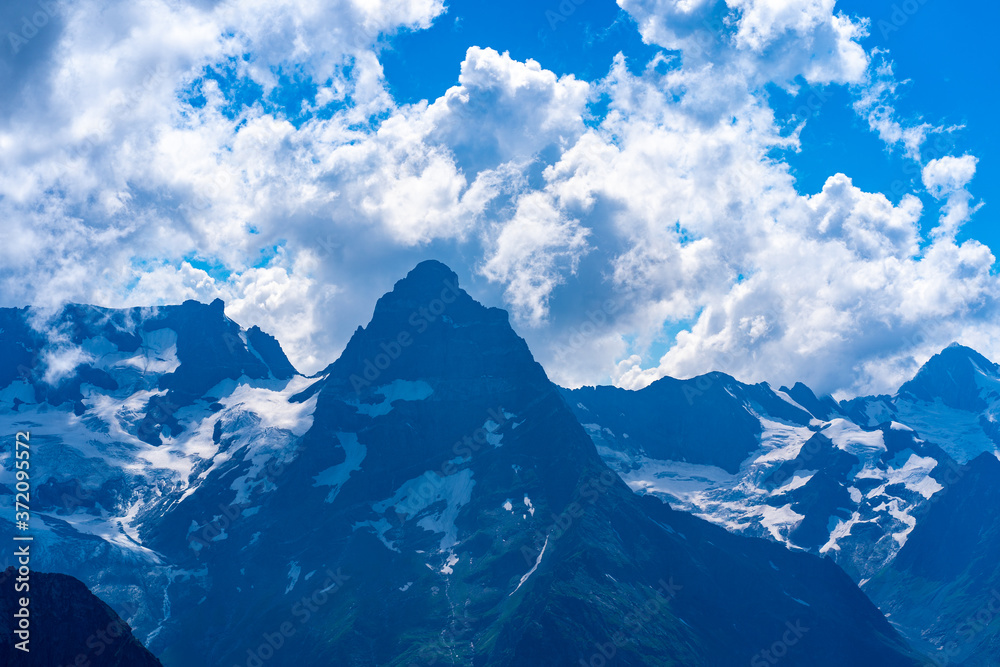 The rocky mountains were shrouded in clouds on a Sunny day. Stunning mountain views The rocky mountains were shrouded in clouds on a Sunny day. Stunning mountain views