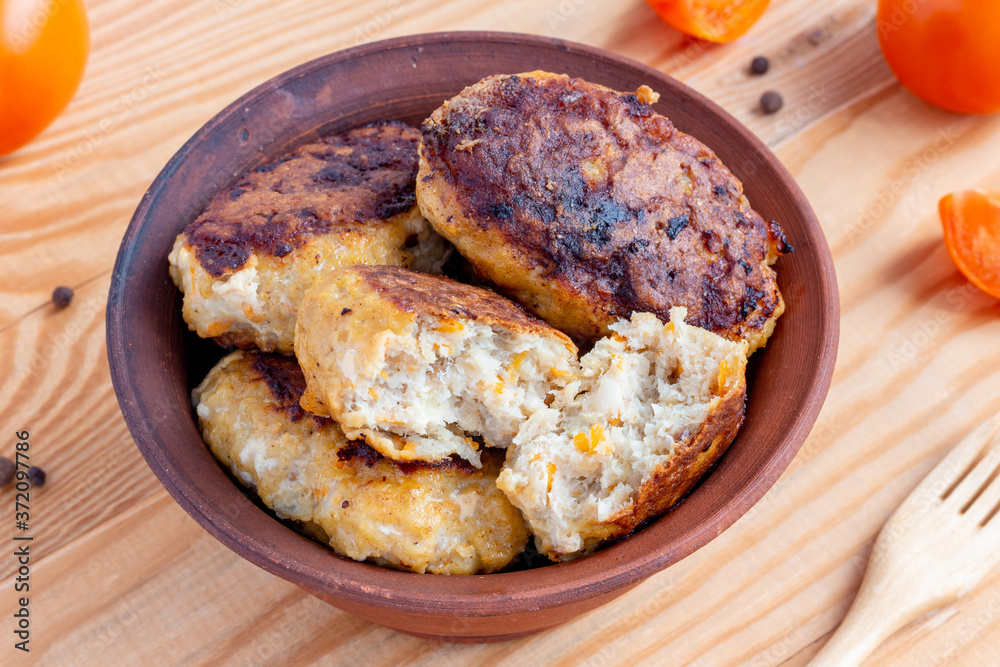 Juicy homemade fish cutlets on wooden background. Top view Juicy homemade fish cutlets on wooden background. Top view
