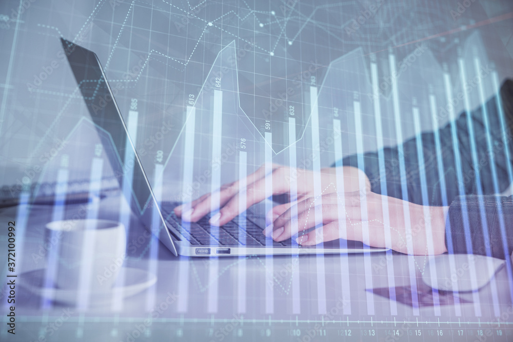 Double exposure of businesswoman hands typing on computer and forex graph hologram drawing. Financial analysis concept. Double exposure of businesswoman hands typing on computer and forex graph hologram drawing. Financial analysis concept.