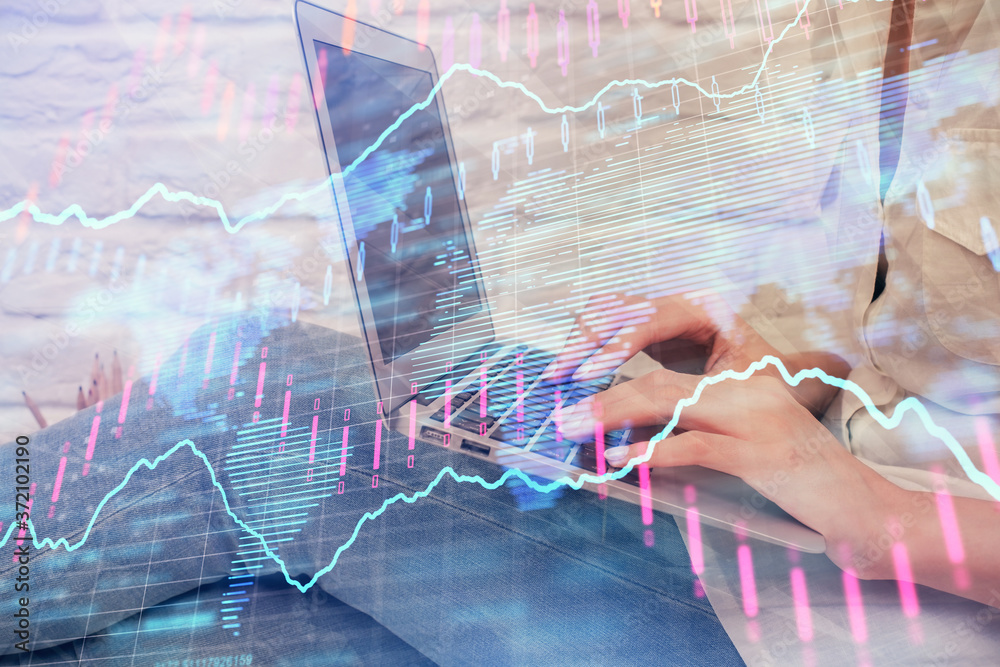 Multi exposure of woman hands typing on computer and forex chart hologram drawing. Stock market analysis concept. Multi exposure of woman hands typing on computer and forex chart hologram drawing. Stock market analysis concept.
