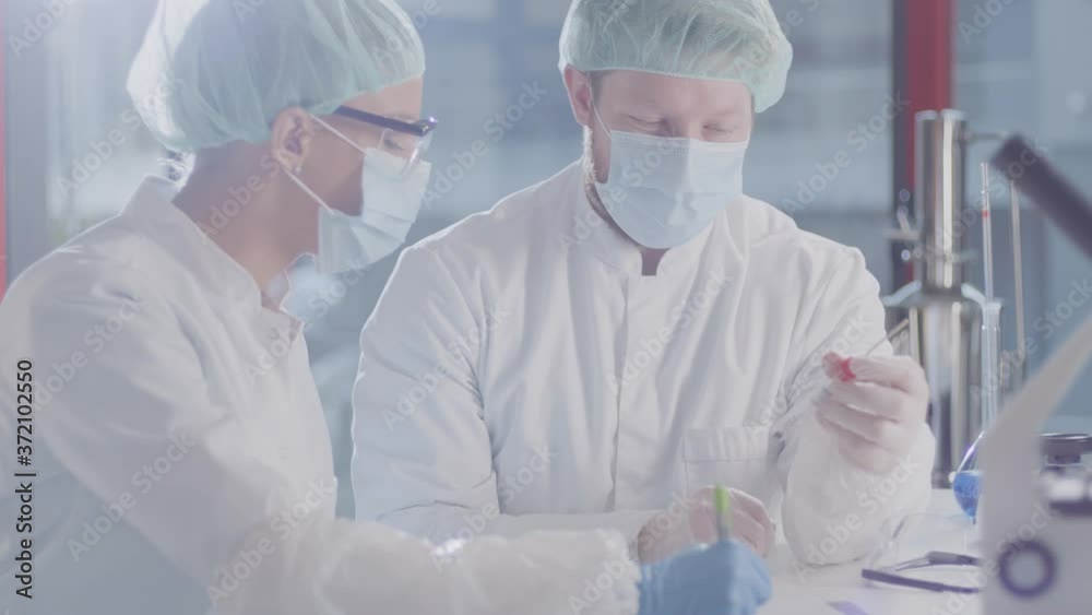 Thoughtful medical colleagues discussing results in a modern laboratory