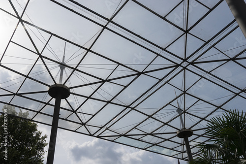 Closeup of a modern steel - glass roofing, constructed like big umbrellas