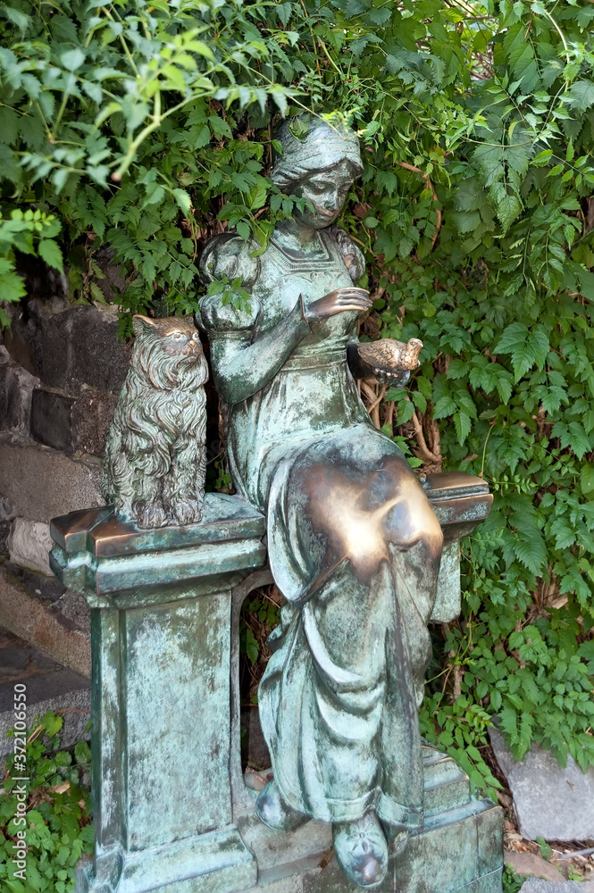 The bronze statue depicting a woman with cat and bird in the park of Batumi, Georgia