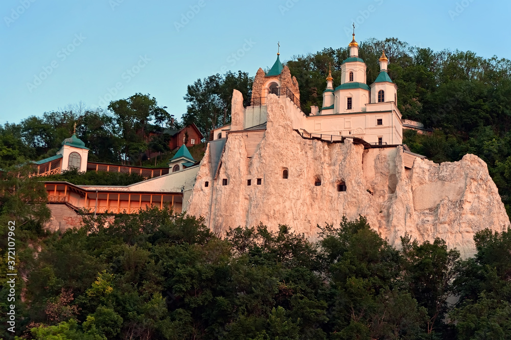 The cathedral on a chalk mountain of Sviatohirsk Lavra in Sviatohirsk, Ukraine at sunset