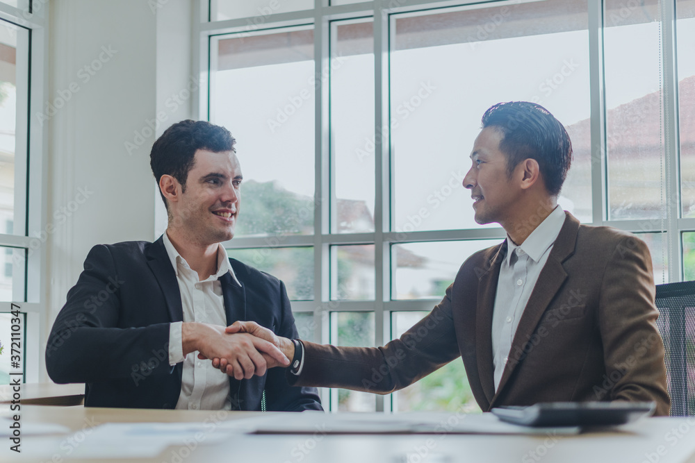 Business people can make business deals. The congratulatory handshake. Business people can make business deals. The congratulatory handshake.