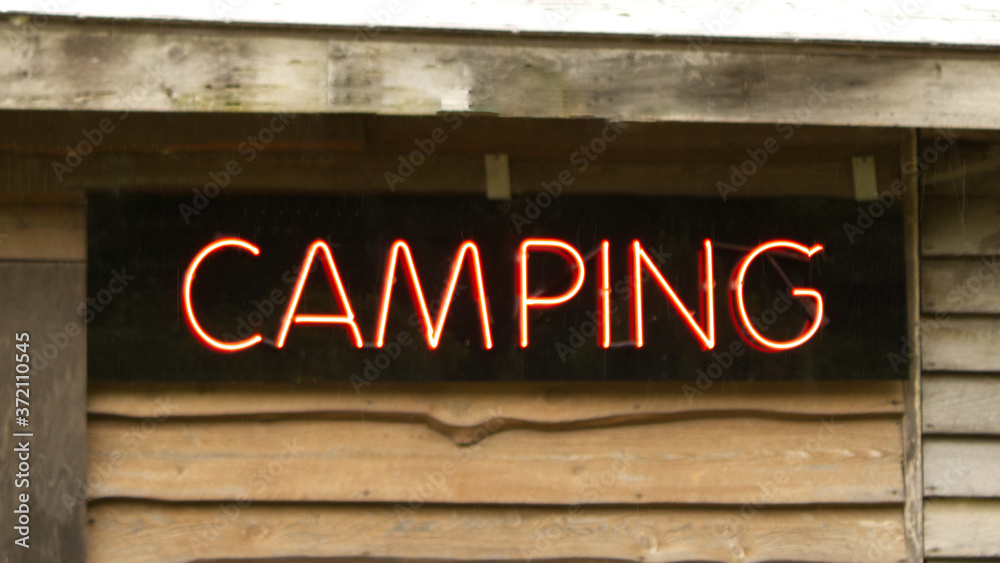A Neon Colorful Camping Sign