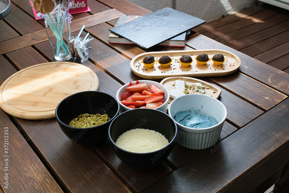 Strawberries with pistachio turron, blue butter cream, pistachios