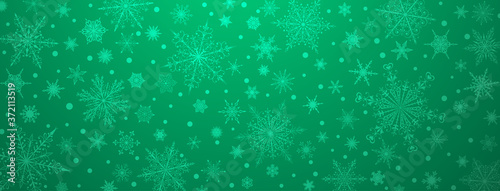 Christmas background of various complex big and small snowflakes  in green colors