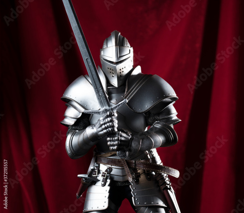 knight with sword and red velvet background
