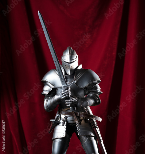 knight with sword and red velvet background