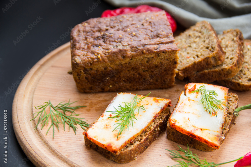 Delicious bread with garlic, lard, herbs, and chili Delicious bread with garlic, lard, herbs, and chili