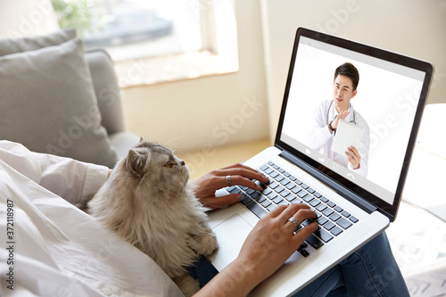 young asian woman receiving an online diagnosis using tele-medicine network