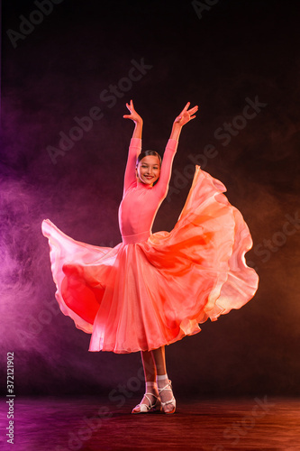 Girl athlete dancing sports ballroom dancing.