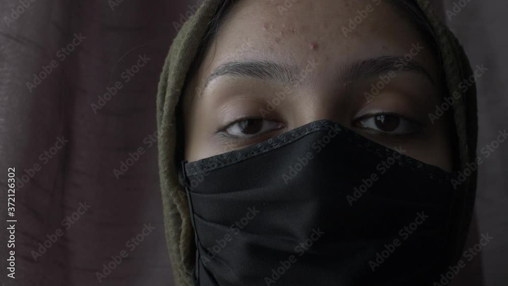 Hijab Woman Wearing Cotton Face Mask. Close Up, Looking At Camera, Locked Off