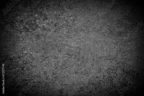 Background image of a black and white plaster wall surface. Distinctive product background. Images that are strong, seductive, attractive.