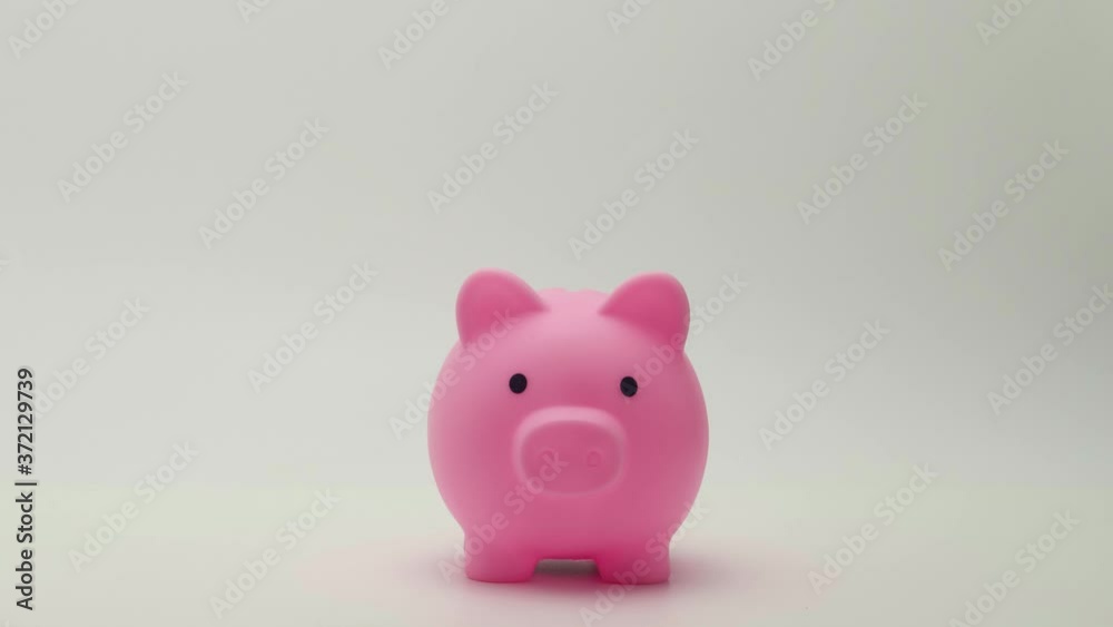 Stop motion piggy bank business concepts ideas of investment retirement finance and save money for future. Stop motion piggy bank business concepts ideas of investment retirement finance and save money for future.