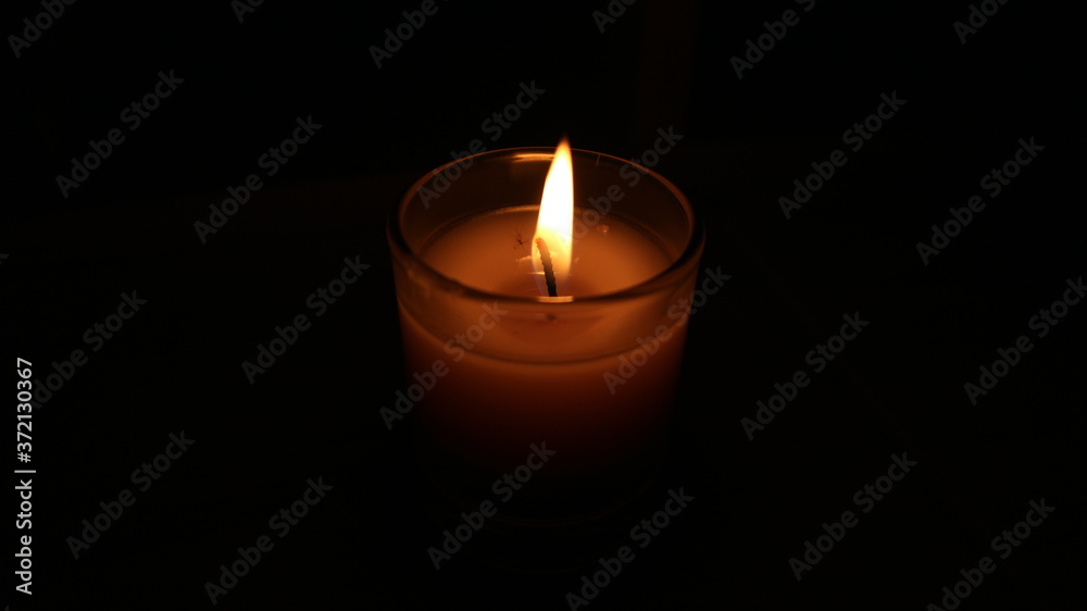 candle on black background candle on black background