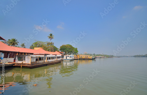 House boats parked in Kollam ferry terminal on Ashtamudi lake.