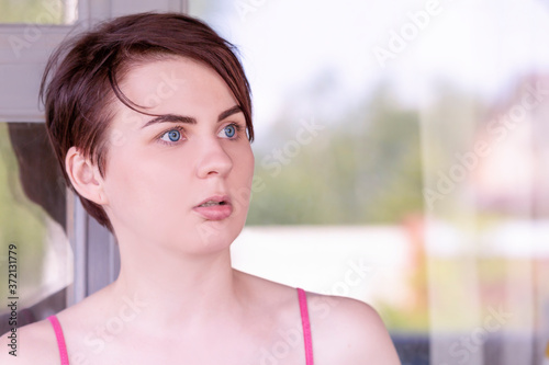 Portrait of a stunned girl with her mouth open in surprise