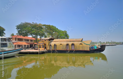 House boats parked in Kollam ferry terminal on Ashtamudi lake.