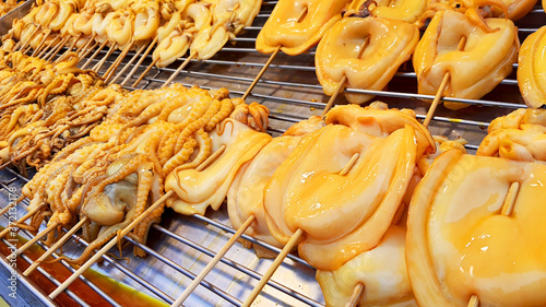 Grilled Squid Popular Street Food In Thailand BBQ Squid On A Stick Grilled Buttered Fresh Squid Many Of Grilled Squid In Thai Market Street Food 
