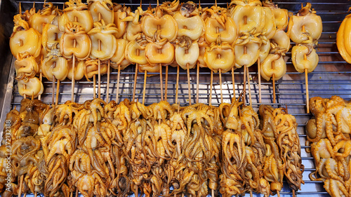 Grilled Squid Popular Street Food In Thailand BBQ Squid On A Stick Grilled Buttered Fresh Squid Many Of Grilled Squid In Thai Market Street Food 