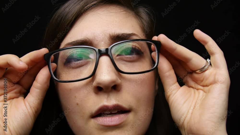Woman puts on glasses and her world comes into focus. Woman puts on glasses and her world comes into focus.