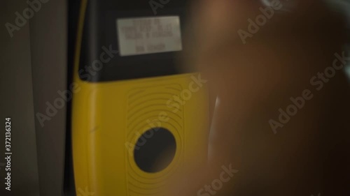 Hand Tapping Andante Public Transportation Card In Porto, Portugal - close up slowmo