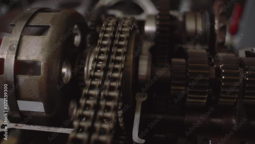 Close Up of Gears and Chains in Open Motorcycle Engine Close Up of Gears and Chains in Open Motorcycle Engine
