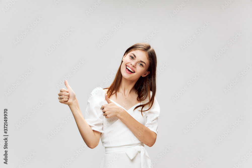 woman gesturing with hands showing thumbs up smile woman gesturing with hands showing thumbs up smile