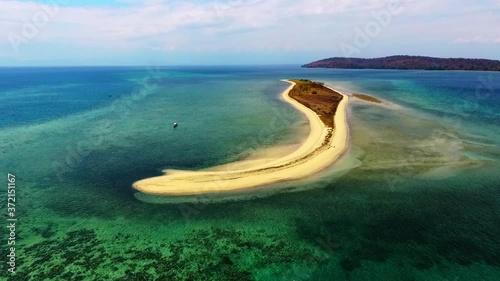 Travel Indonesia. Wide aerial view of Dangar Ode Island. Top destination for vacation. Golden sand beaches and clear blue ocean. photo