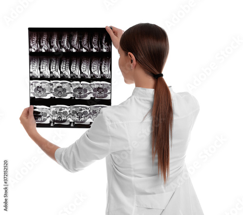 Orthopedist holding X-ray picture on white background