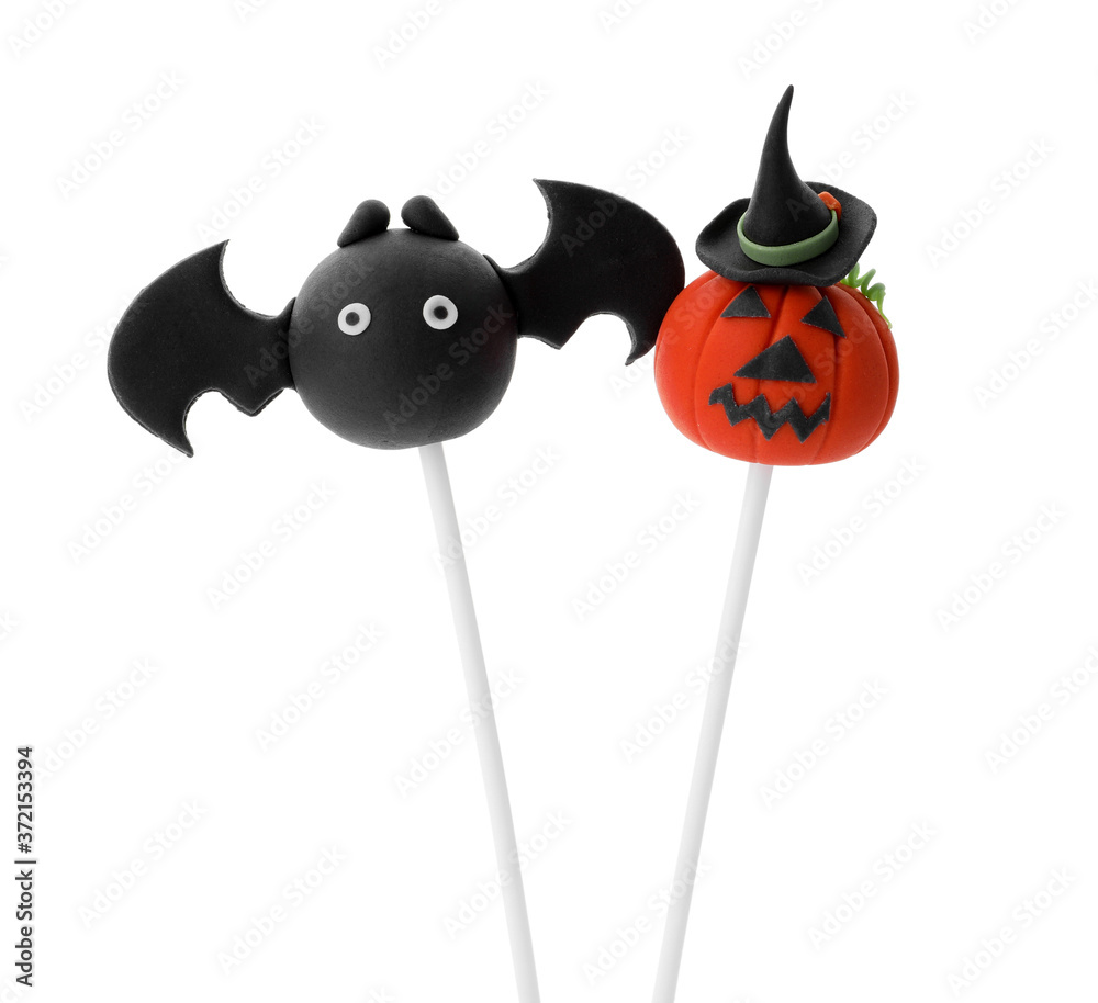 Delicious Halloween themed cake pops on white background Delicious Halloween themed cake pops on white background