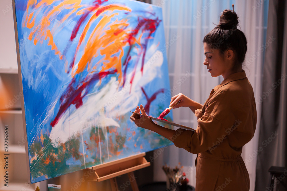 Young Artist Painting On Canvas
