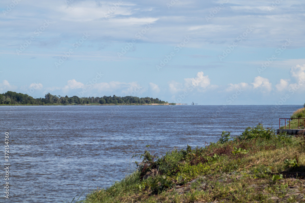Shore of Vistula river near the point where it meets the Baltic sea.